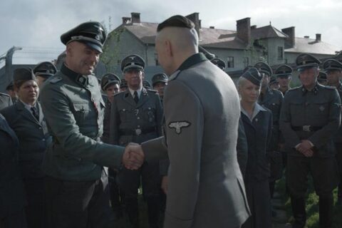 The Zone Of Interest 2023 Movie Scene Nazi's working at Auschwitz congratulating Christian Friedel as Rudolf Höss's birthday