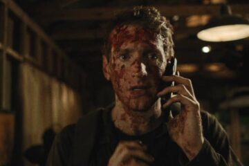 You Might Be The Killer 2018 Movie Scene Fran Kranz as Sam covered in blood talking over the phone