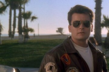 Hot Shots 1991 Movie Scene Charlie Sheen as Topper Harley wearing sun glasses and a leather jacket just like Tom Cruise in Top Gun