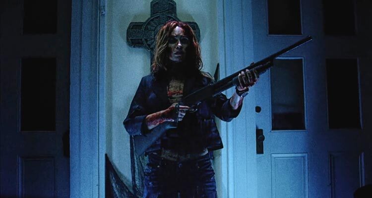 Night of the Demons 2009 Movie Scene Monica Keena as Maddie all bloody holding a shotgun