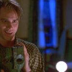 The Mask 1994 Movie Scene Jim Carrey as Stanley Ipkiss holding the mask and looking in the mirror