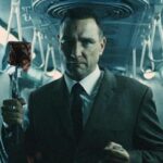 The Midnight Meat Train 2008 Movie Scene Vinnie Jones as Mahogany holding a bloody butchers hammer in the train