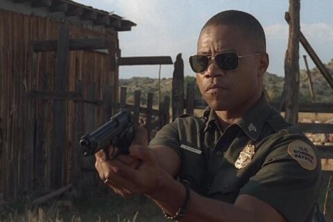 Linewatch 2008 Movie Scene Cuba Gooding Jr. as Michael Dixon in his border patrol uniform holding a gun pointed at the criminals