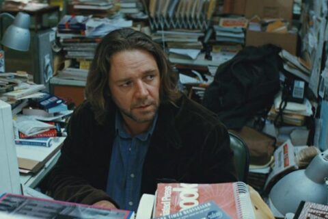 State of Play 2009 Movie Scene Russell Crowe as journalist Cal McAffrey working at his desk on a big story about a congressman and his murdered aide