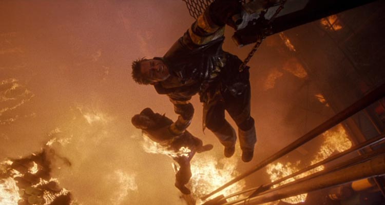 Backdraft 1991 Movie Scene Kurt Russell as Stephen McCaffrey holding Scott Glenn as John Adcox above the fiery pit
