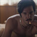 Dusk For A Hitman 2023 Movie Scene Éric Bruneau as Donald Lavoie smoking in bed after sex