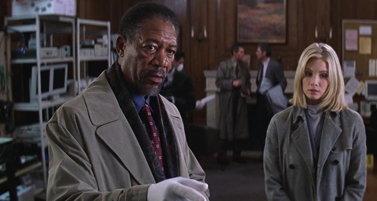 Along Came a Spider 2001 Movie Scene Morgan Freeman as Alex Cross on the crime scene pointing at something with Monica Potter as Jezzie standing in the background