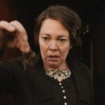 Wicked Little Letters 2023 Movie Scene Olivia Colman as Edith Swan looking at the clump of hair in disgust